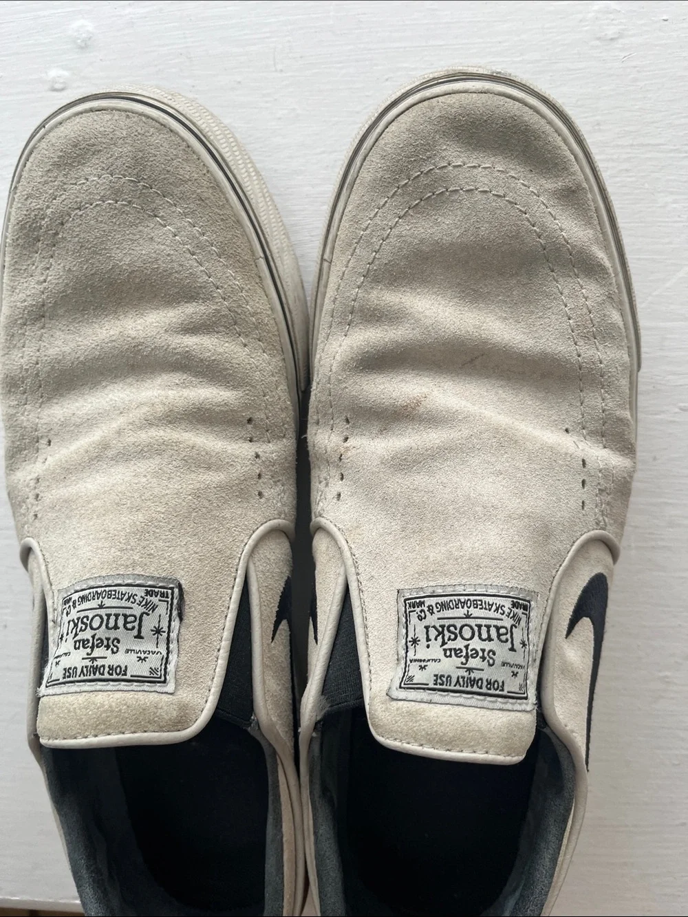 Nike Stefan Janoski Slip-On Loafers in White and Black